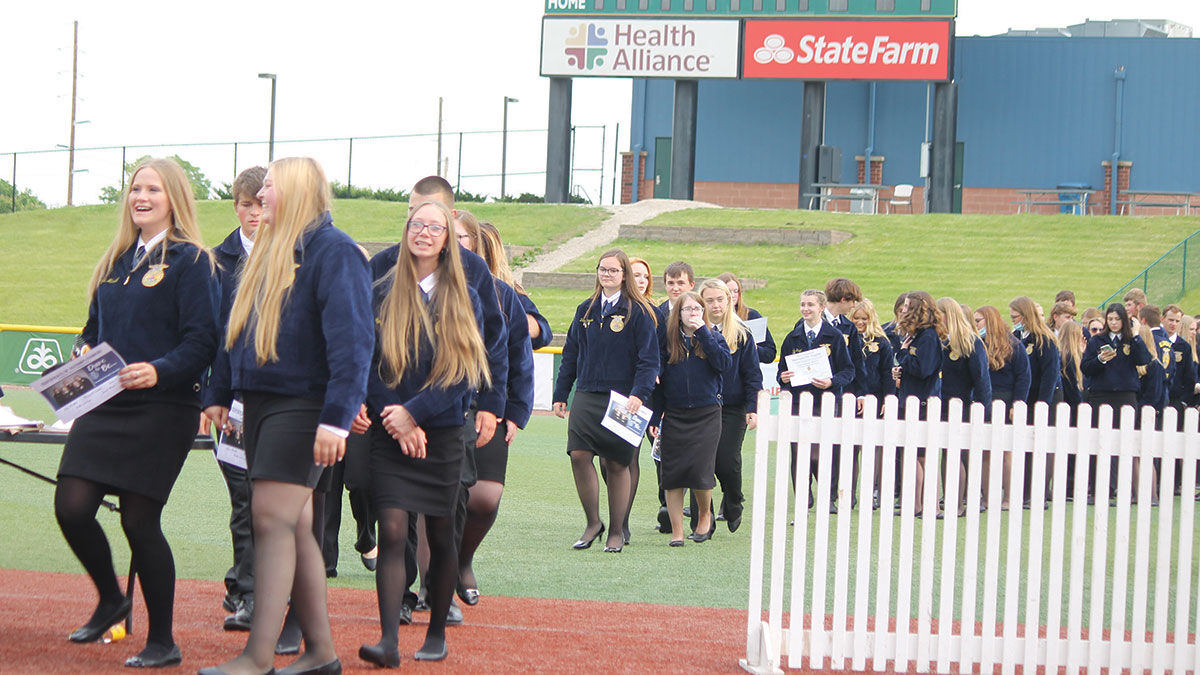 Students file into the Corn Crib baseball stadium